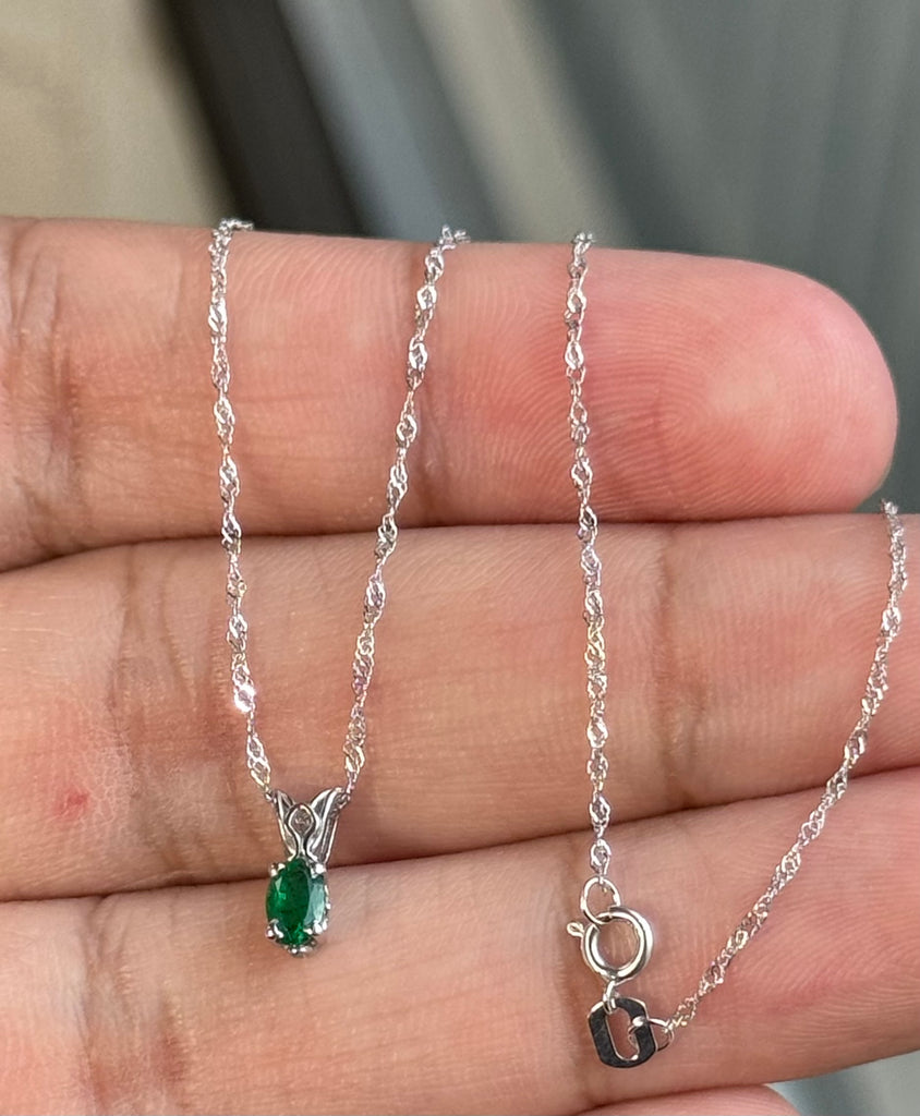 0.14-0.26 Cts of 5x3 mm AA Oval Natural Emerald Scroll Solitaire Pendant in Platinum