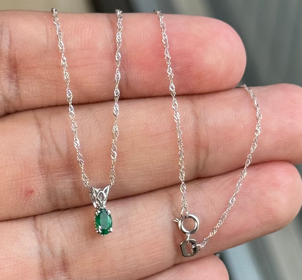 0.14-0.26 Cts of 5x3 mm AA Oval Natural Emerald Scroll Solitaire Pendant in Platinum