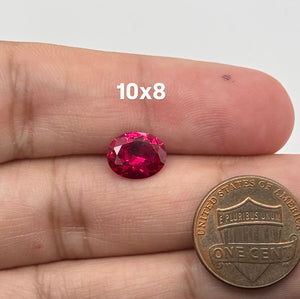 Lab Grown Ruby Oval #5 faceted red loose gemstone on white background