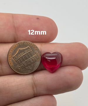 Lab Grown Ruby Heart Cab Flat Back #5 polished red heart gemstone on white background
