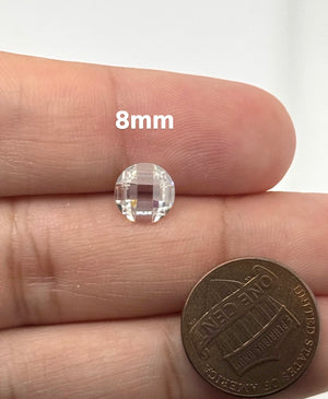Lab Grown White Moissanite round briolette double checker cut gemstone displaying exceptional brilliance, DEF color, and precision faceting.