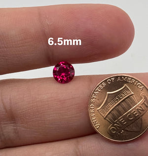 synthetic ruby round pinkish red 6.5mm to 7mm loose gemstone
