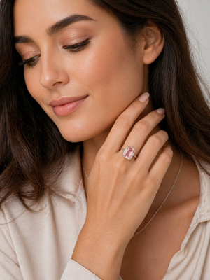 Hand wearing pink gemstone ring styled for anniversary dinner elegant jewelry look