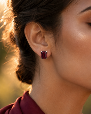Woman wearing natural AAA garnet stud earrings for an elegant evening look 