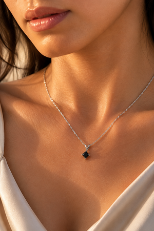 Black diamond pendant worn on the neckline for everyday styling with a princess cut black diamond necklace 