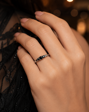 Natural Black Diamond Ring worn on a woman's finger during an elegant anniversary celebration 