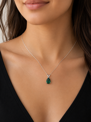 AAA pear-cut lab-created emerald pendant in 14K white gold with a four-prong solitaire setting