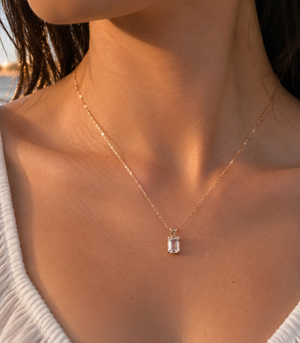 Woman wearing a 14K Rose Gold Morganite pendant for an elegant anniversary look