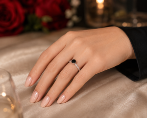 Woman wearing Black Diamond Engagement Ring during proposal showcasing certified black diamond ring elegance 