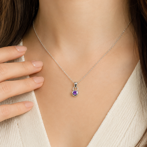 Amethyst silver pendant worn at the neckline with an elegant outfit showcasing an AA amethyst solitaire pendant 