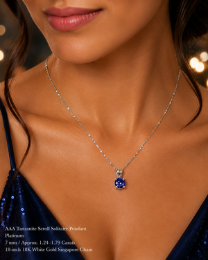 Woman wearing platinum tanzanite pendant necklace styled for anniversary dinner elegant jewelry