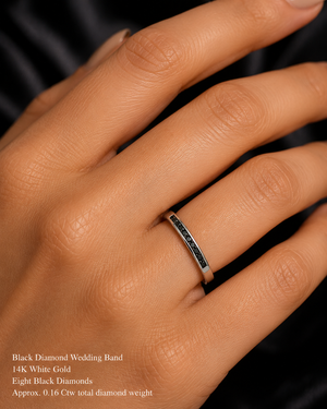 Black diamond ring worn on hand styled for anniversary dinner contemporary wedding jewelry