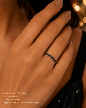 Black diamond ring worn on hand styled for anniversary dinner modern bridal jewelry