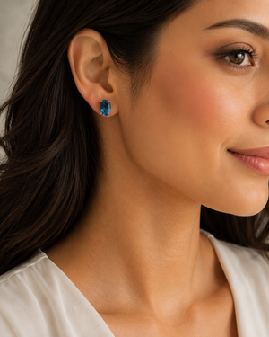 Woman wearing blue topaz stud earrings elegant everyday minimalist jewelry