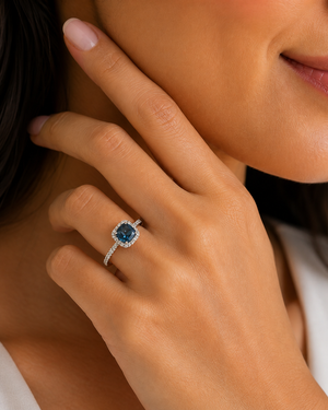 Woman wearing blue topaz ring elegant minimalist everyday style