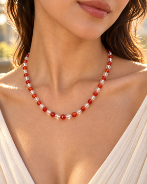 Carnelian quartz necklace worn at the neckline, styled as an elegant silver gemstone necklace for women. 