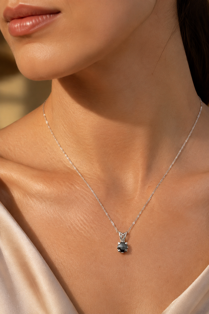 Black diamond pendant worn at the neckline as elegant rose cut diamond jewelry 