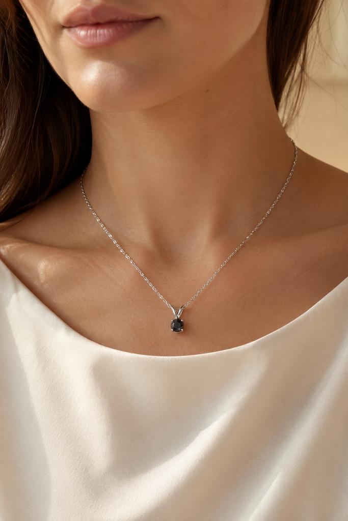 Black diamond solitaire pendant worn at the neckline as a rose cut black diamond necklace 