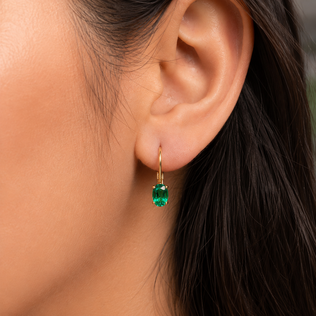 merald earrings worn on ears at dinner event featuring Oval Emerald Earrings 