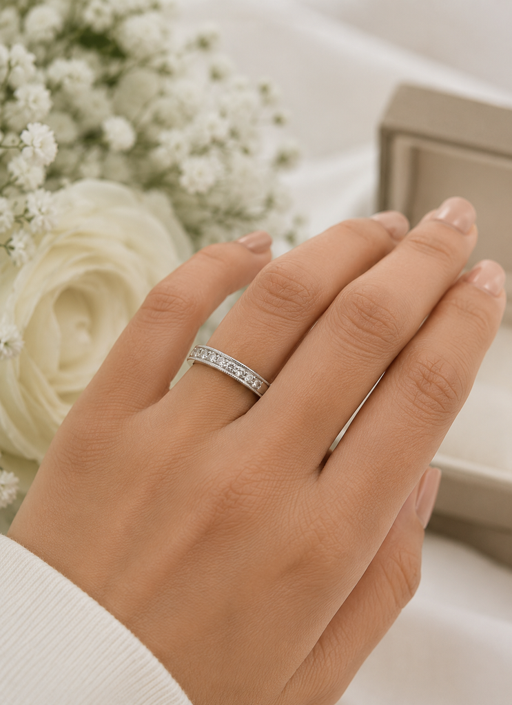 Ring worn on hand during dinner occasion with channel set diamond ring styling 