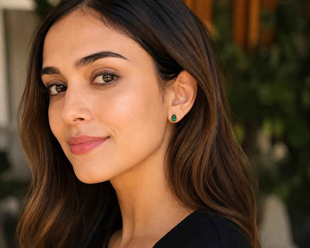 Woman wearing Lab Created Emerald Stud Earrings styled as Pear Cut Emerald Earrings 