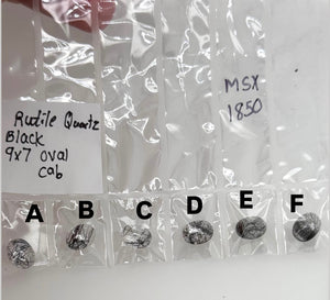 Natural Black Rutile Quartz 9x7mm oval cabochon loose gemstone with dark needle-like rutile inclusions, smooth dome polish, AAA quality cab stone for custom rings, pendants, and jewelry making supplies.