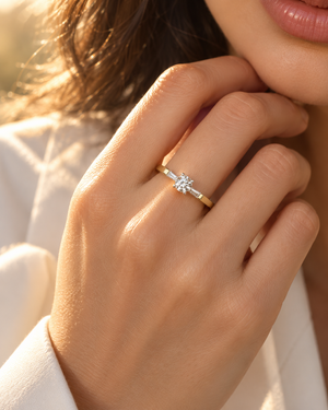 Natural diamond gold ring worn on the hand with everyday clothing, styled as a 1/4 carat diamond ring 