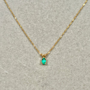 Subtle green emerald pendant 0.18–0.26 Cts in 14K yellow gold with clean oval solitaire form