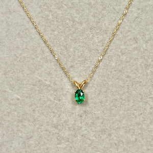 Minimal emerald pendant for everyday use 0.30–0.48 Cts set in 14K yellow gold oval form with Enduring Craft depth