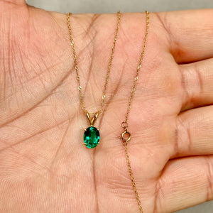 Lab created emerald solitaire pendant in 14k yellow gold