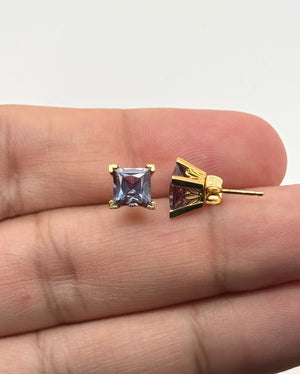 Jewelry collection styling gold studs with gemstone pieces modern minimalist fashion
