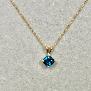 London blue topaz cushion cut solitaire pendant in 14k yellow gold