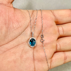 London blue topaz and diamond pendant in 14k white gold