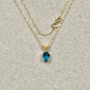 London blue topaz scroll pendant in 18k yellow gold