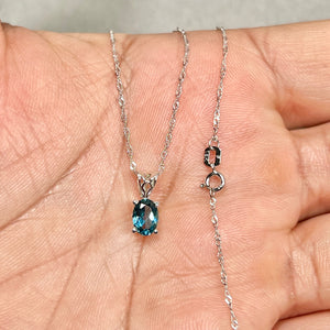 London blue topaz scroll pendant in 18k white gold