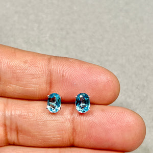 Swiss blue topaz stud earrings in 14k white gold oval cut