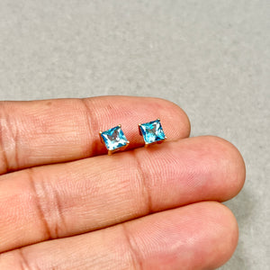 Crafted as 1.70–1.85 Ct 14K Yellow Gold Swiss Blue Topaz Stud Earrings shaped with Sculptural structure and modern clarity