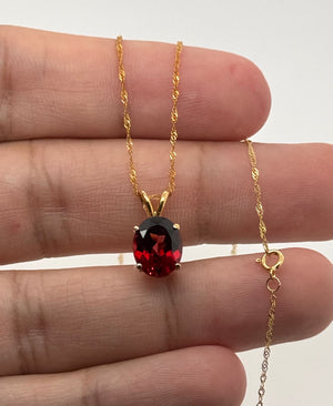 10x8mm Garnet Pendant | 14K Yellow Gold Oval Solitaire Necklace — January Birthstone Jewelry
