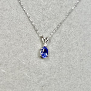 0.02 Ct Diamond & 1.25 Ct Platinum Tanzanite Pendant for women with Sculptural oval balance and violet depth