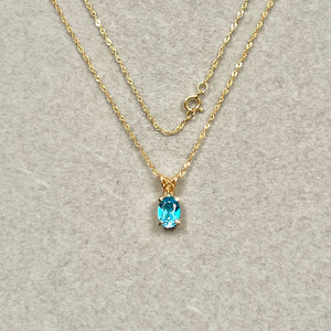 0.85–1.05 Cts AAA Oval Swiss Blue Topaz Scroll Pendant 14K Yellow Gold – 18” Chain