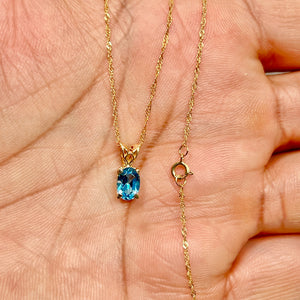 0.85–1.05 Cts AAA Oval Swiss Blue Topaz Scroll Pendant 14K Yellow Gold – 18” Chain