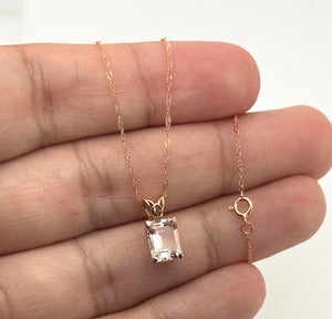 Side profile highlighting the scroll setting and polished 14K Rose Gold craftsmanship
