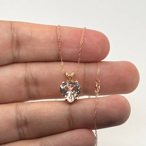 Heart-shaped morganite pendant paired with coordinating rose gold jewelry.