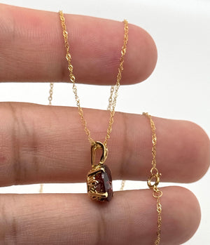 Elegant Garnet necklace styled for anniversary dinner and romantic occasions.