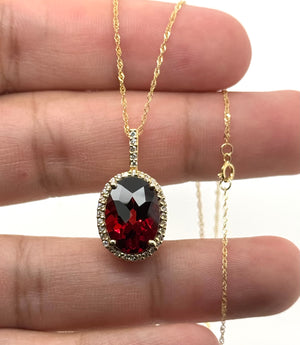 AAA oval garnet gemstone with red color and diamond accent detailing