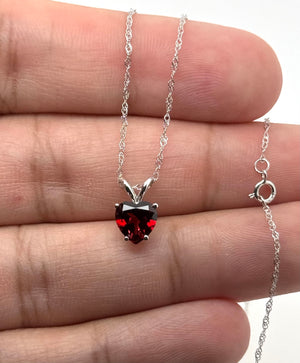 Polished 14K White Gold solitaire pendant with detailed side profile.