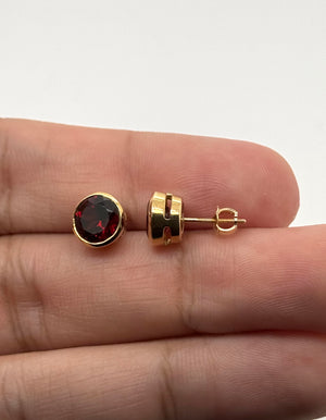 Contemporary Garnet stud earrings styled for everyday luxury and special occasions.
