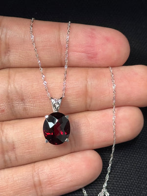 Large oval garnet scroll pendant in 14K white gold