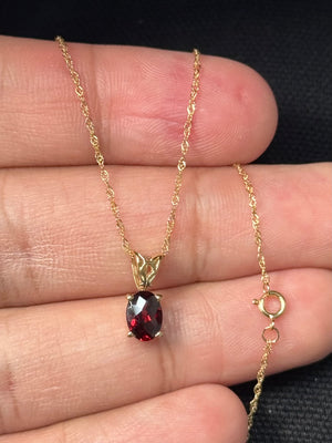 natural garnet solitaire pendant in 14k yellow gold oval gemstone