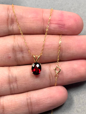 natural garnet solitaire pendant in 14k yellow gold oval gemstone